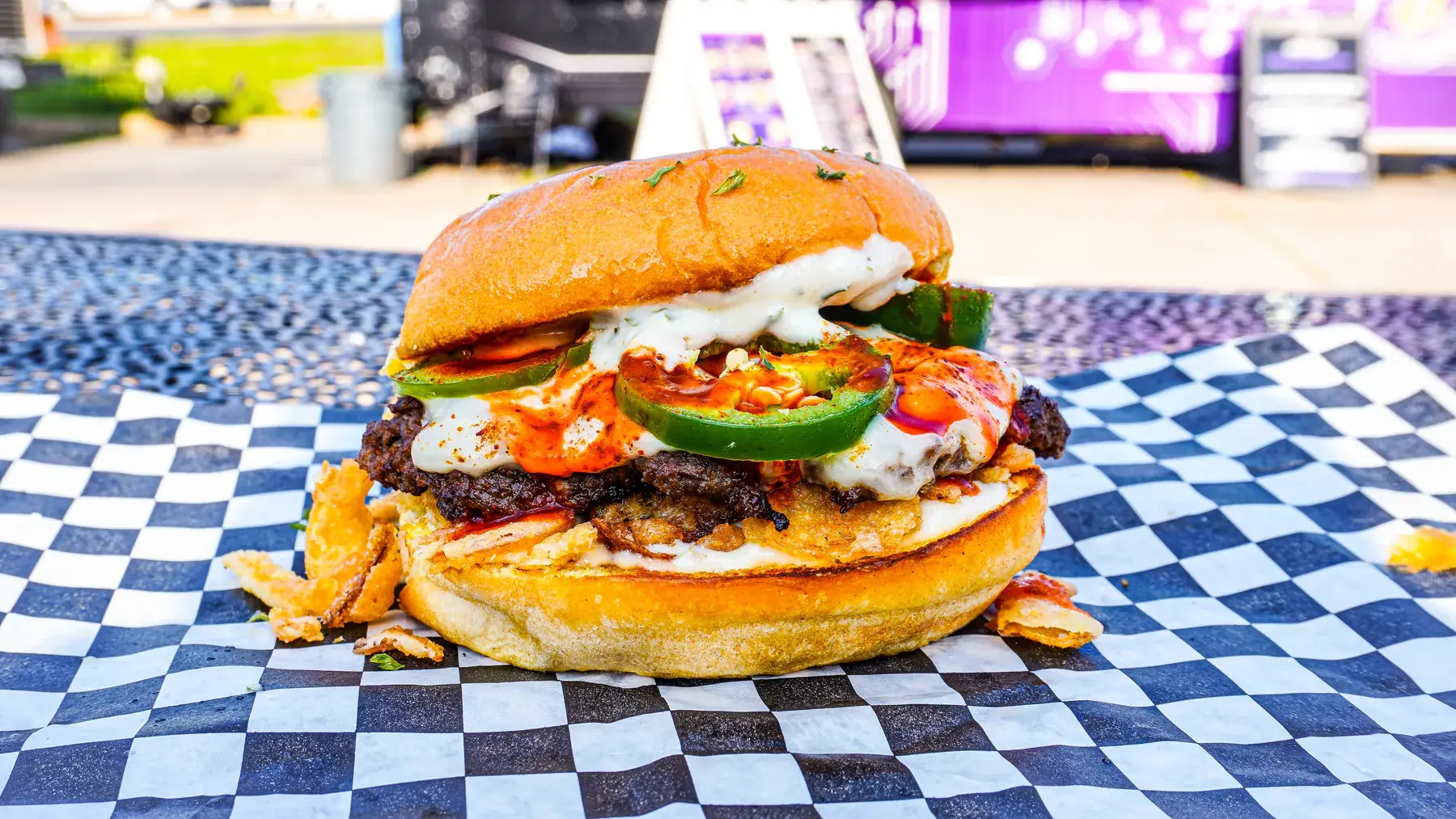 Bunqua Burger with bold toppings from Crypto Burger Houston
